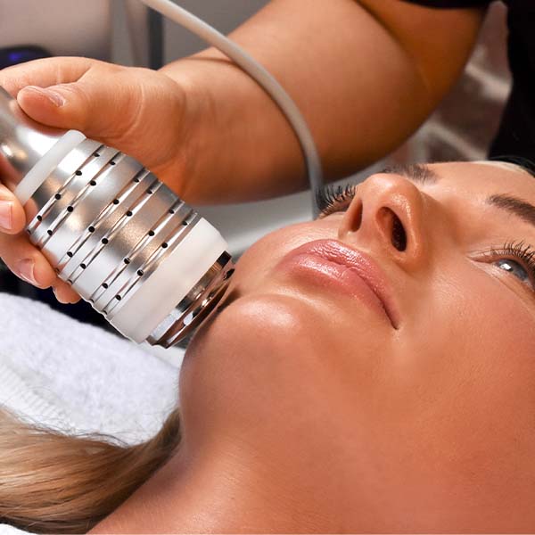 Aesthetician performing deep cleansing facial for smoother, brighter skin